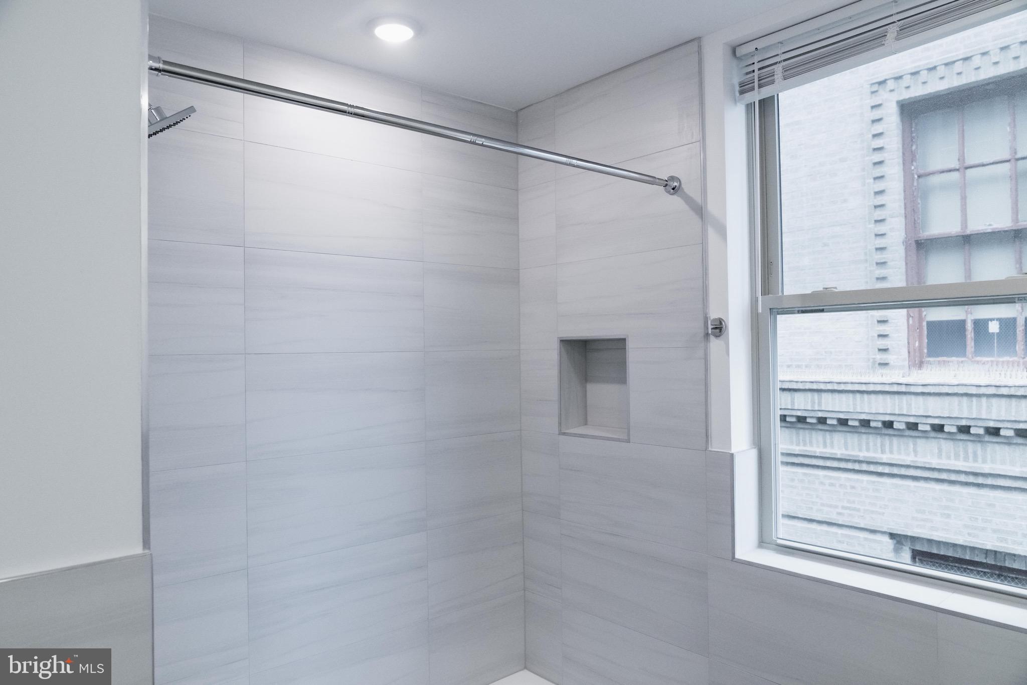 7248 Rising Sun Avenue, Unit 201 Philadelphia, PA 19111 - Photo 15 of 20 a bathroom with a shower and a sink