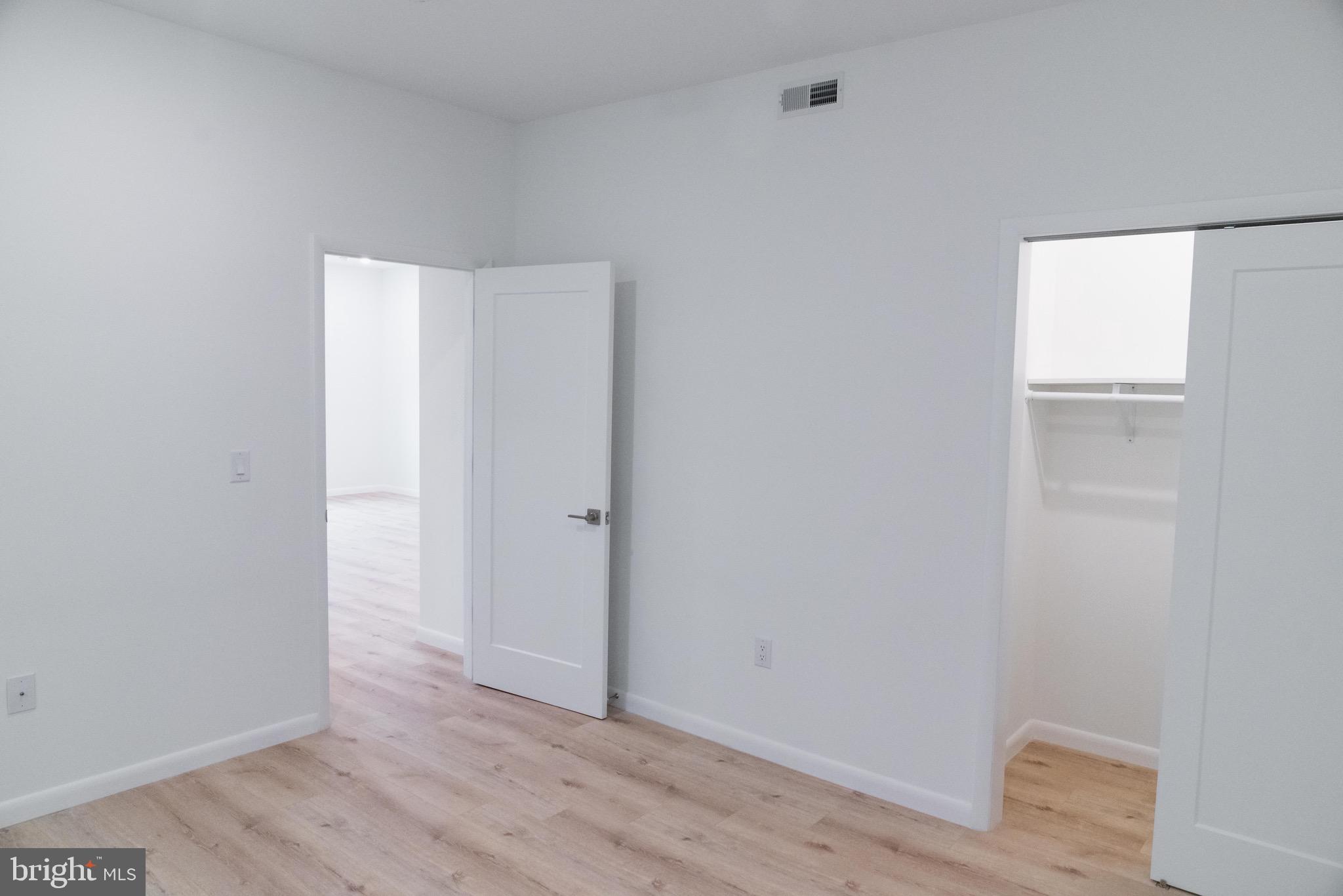 7248 Rising Sun Avenue, Unit 208 Philadelphia, PA 19111 - Photo 15 of 19 a view of an empty room with wooden floor