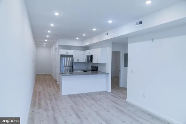 a view of kitchen with wooden floor