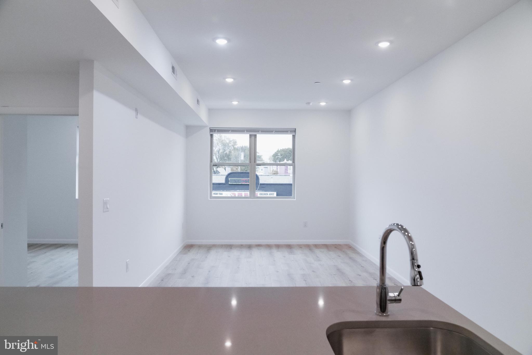 7248 Rising Sun Avenue, Unit 208 Philadelphia, PA 19111 - Photo 7 of 19 a view of a sink and chandelier in a room