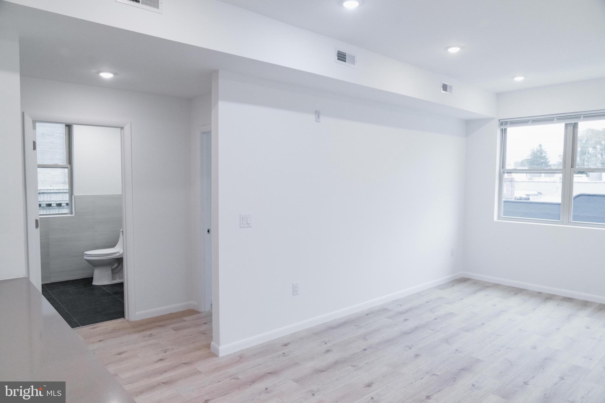 7248 Rising Sun Avenue, Unit 208 Philadelphia, PA 19111 - Photo 8 of 19 a view of an empty room and a bathroom