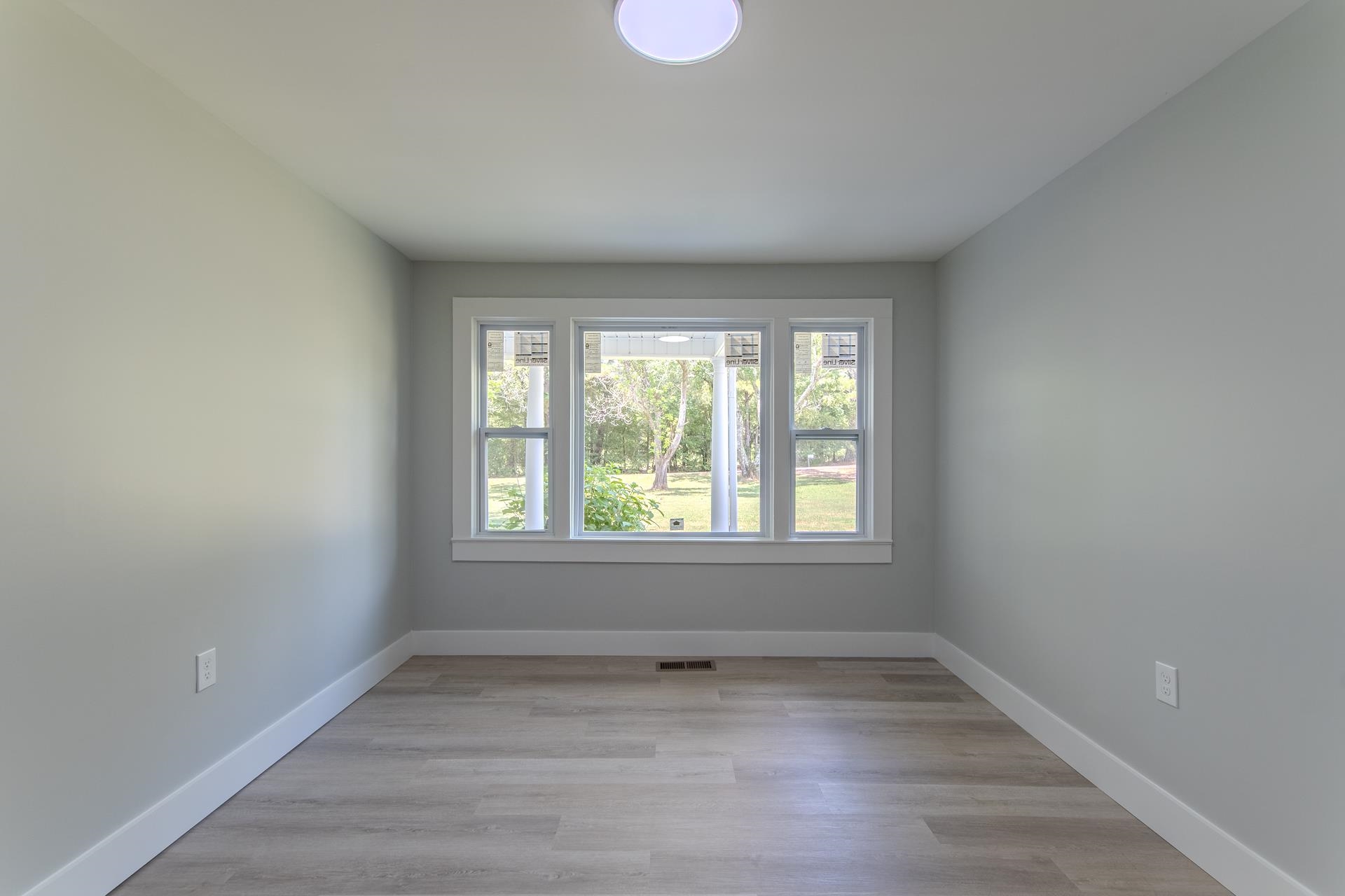 6800 Glendale Road Morris Chapel, TN 38361 - Photo 22 of 40 wooden floor in an empty room with a window