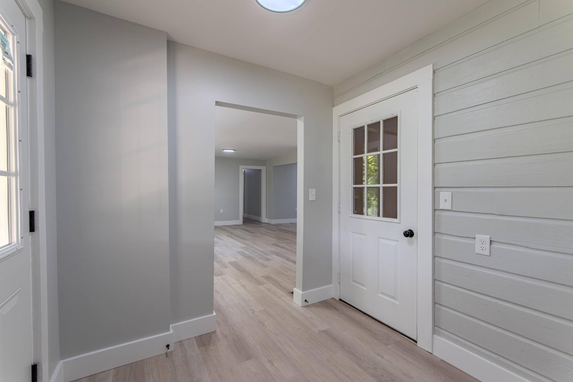 6800 Glendale Road Morris Chapel, TN 38361 - Photo 24 of 40 a view of a hallway with wooden floor and closet