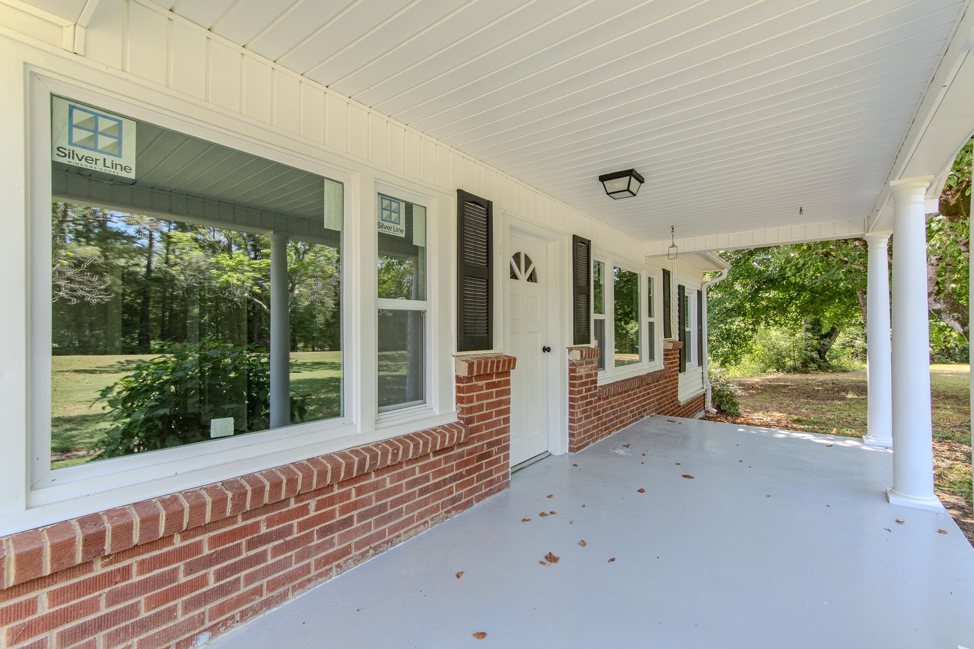 6800 Glendale Road Morris Chapel, TN 38361 - Photo 31 of 40 a view of a porch with a floor to ceiling window
