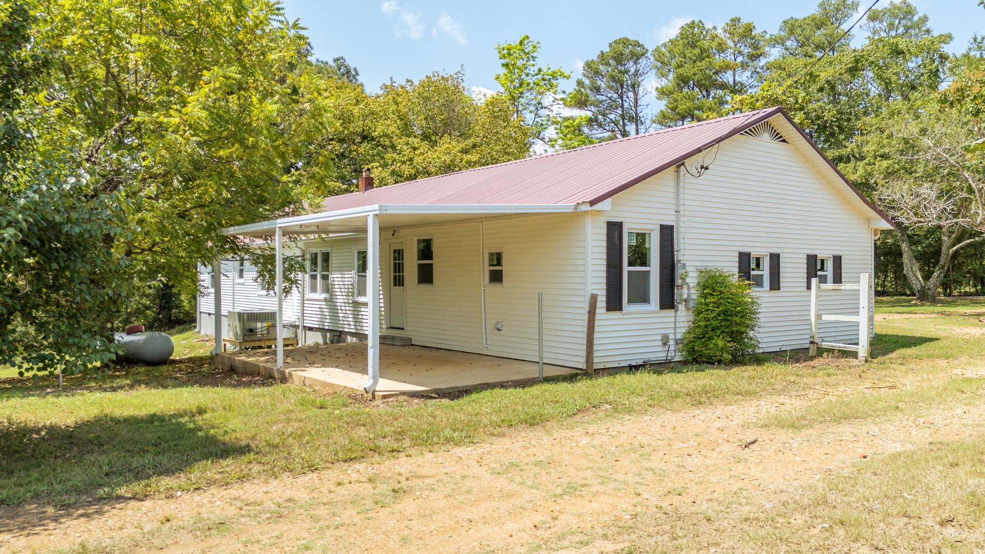 6800 Glendale Road Morris Chapel, TN 38361 - Photo 33 of 40 a view of a house with backyard and sitting area