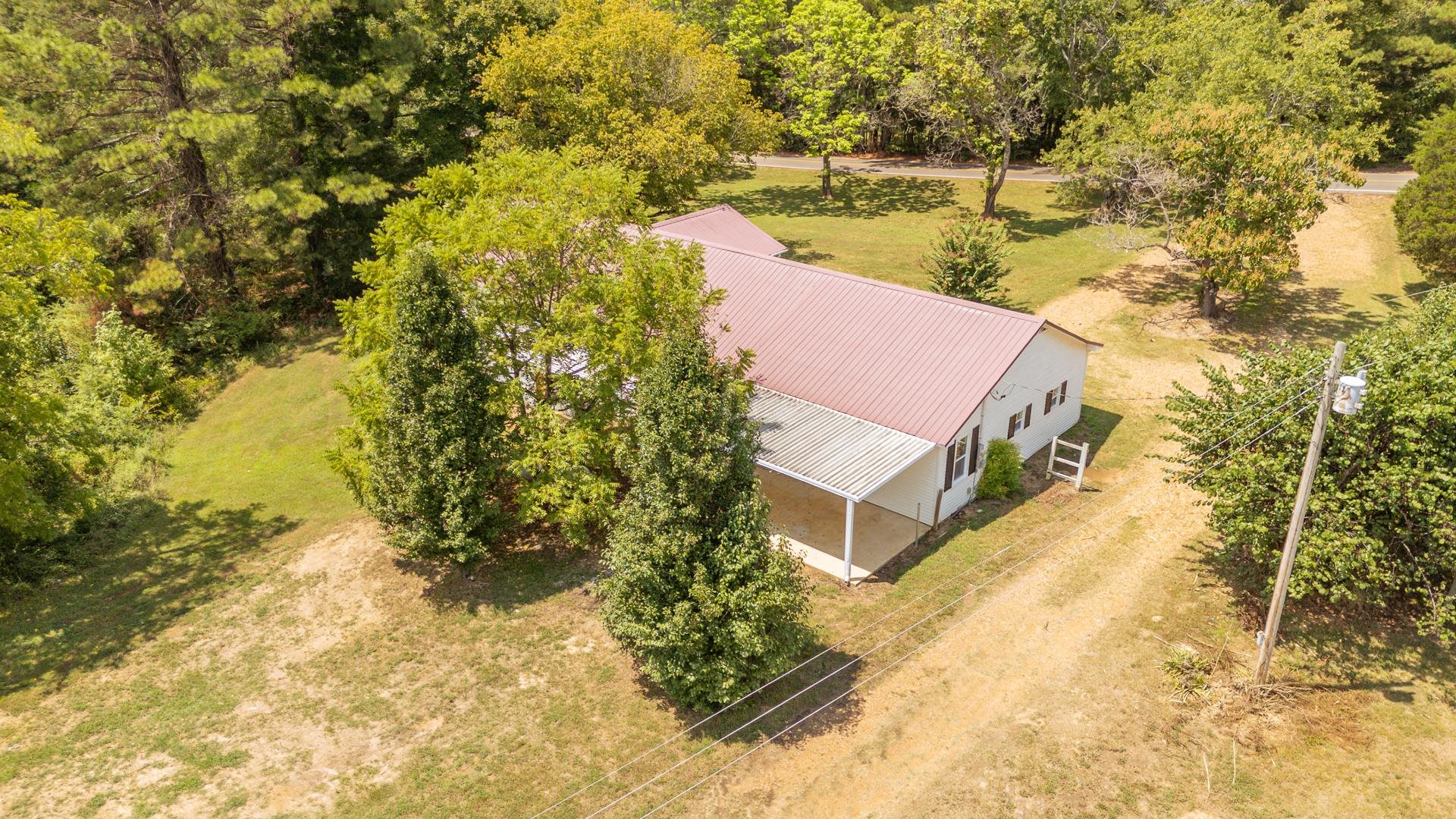 6800 Glendale Road Morris Chapel, TN 38361 - Photo 36 of 40 a aerial view of a house with a yard and lake view