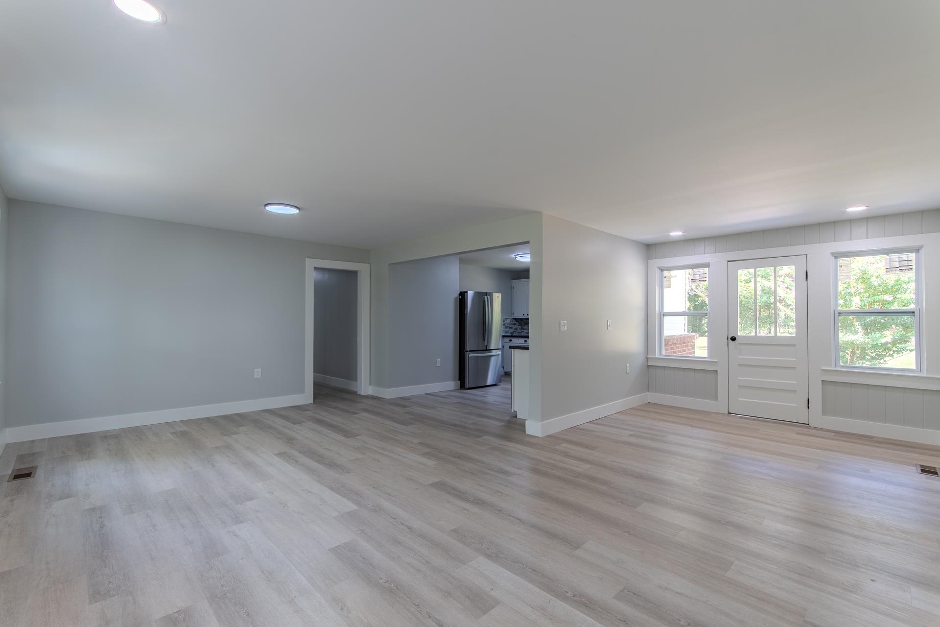 6800 Glendale Road Morris Chapel, TN 38361 - Photo 7 of 40 a view of an empty room with wooden floor and a window