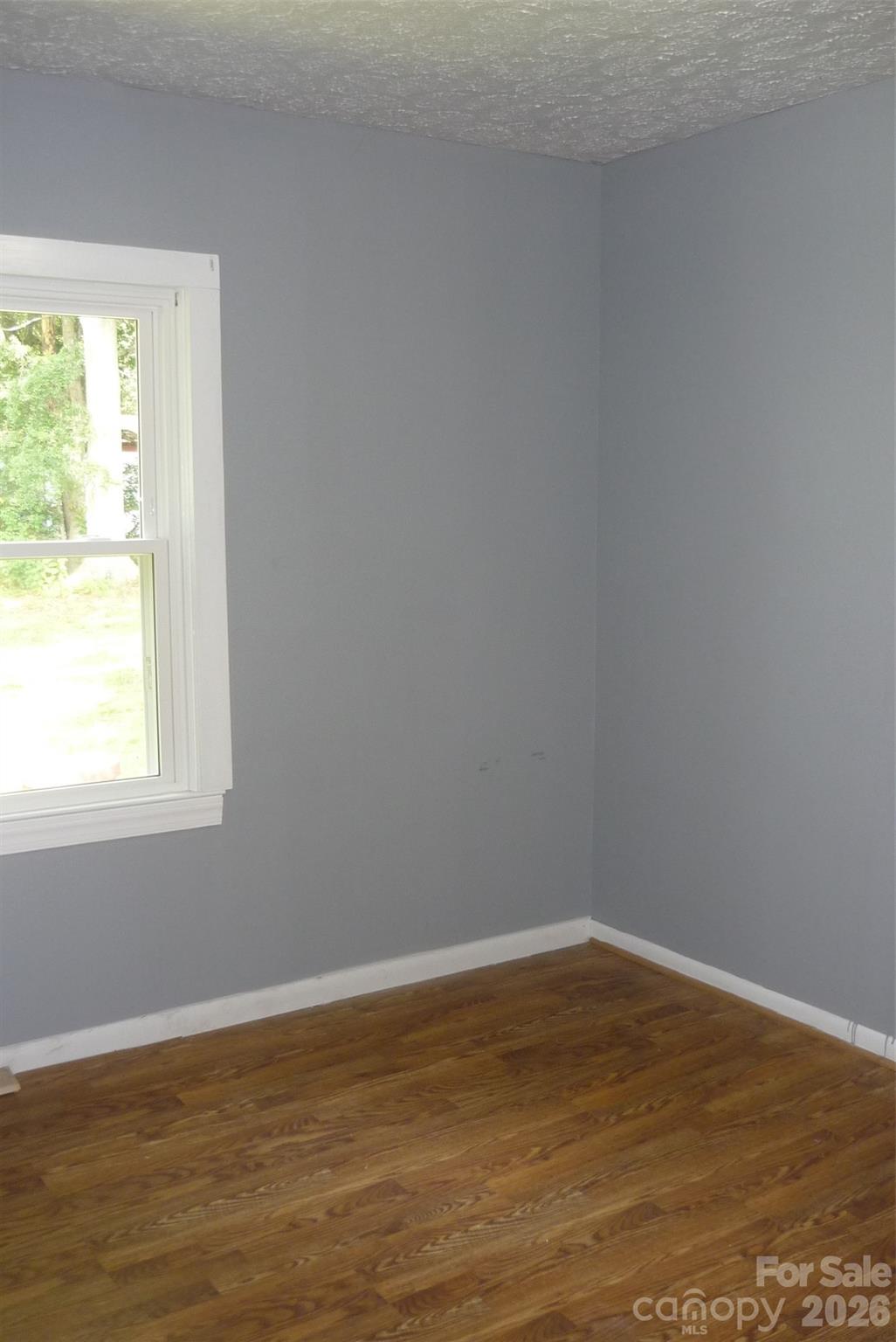 120 Bradley Road Shelby, NC 28152 - Photo 31 of 42 a view of an empty room with wooden floor and a window