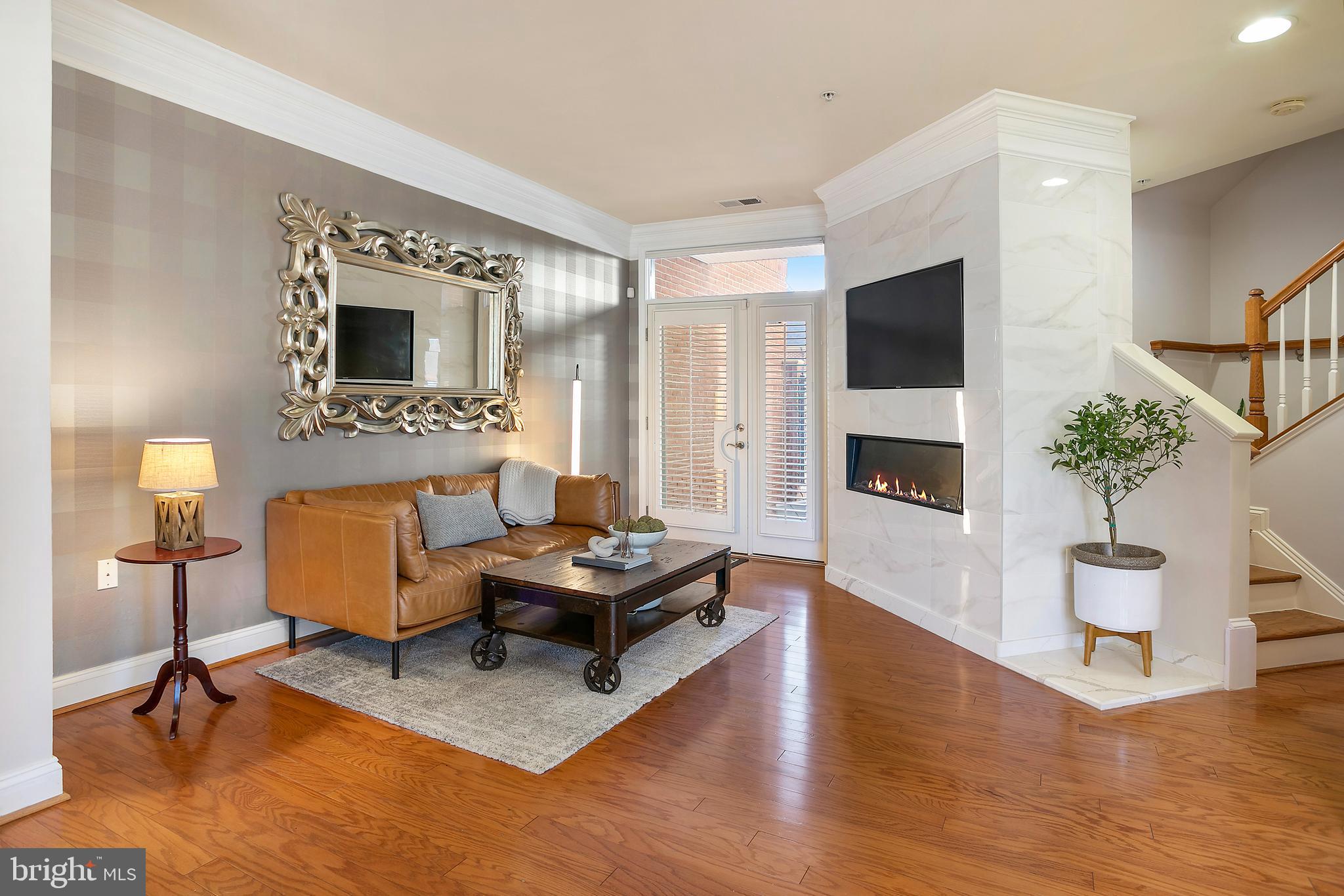 1300 Duke Street Alexandria, VA 22314 - Photo 7 of 36 Living area with cozy fireplace