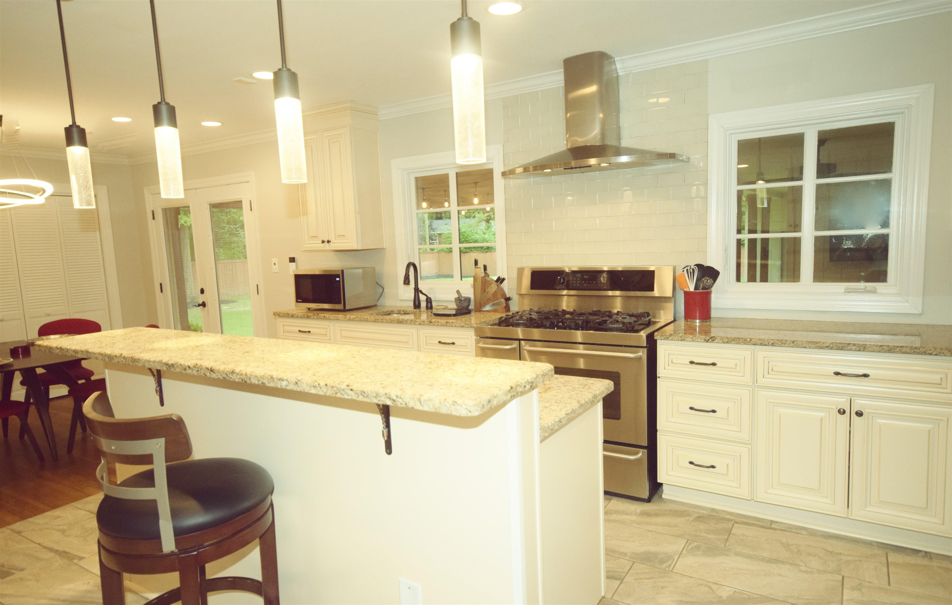 181 South Mendenhall Road Memphis, TN 38117 - Photo 6 of 25 a kitchen with stainless steel appliances granite countertop a sink and cabinets
