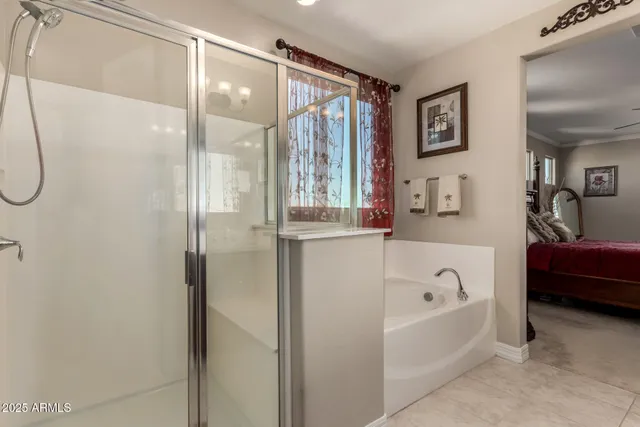 a room that has a bed and a chair in it