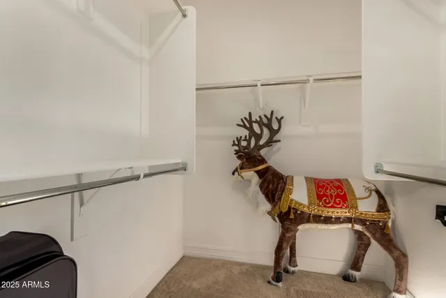 a bedroom with furniture and a flat screen tv