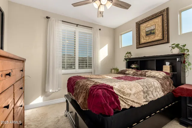 a living room with a bookshelf and a wooden floor