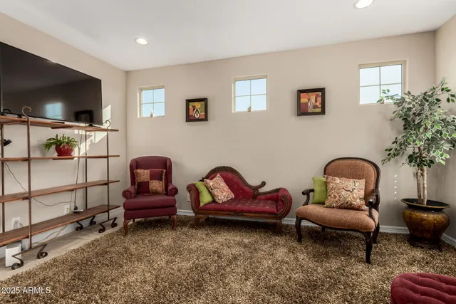 an aerial view of a house with a mountain