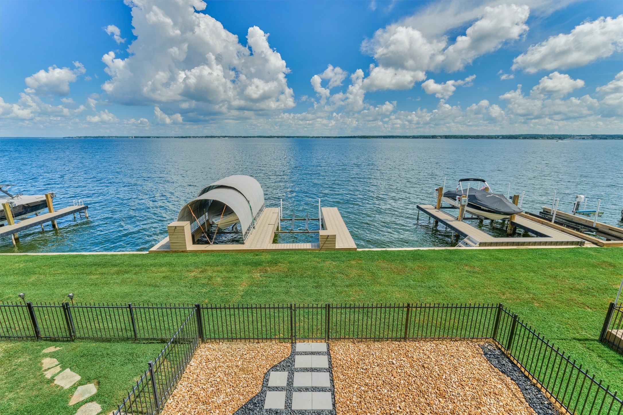 4 Regency Point Montgomery, TX 77356 - Photo 1 of 47 Fenced in yard and private boat slip w/ lift!