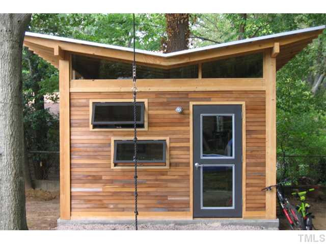 722 Graham Street Raleigh, NC 27605 - Photo 19 of 24 The studio was recently added to mimic the contemporary design of the home. The butterfly roof and sleak horizontal lines mske this a stand out feature of the home. The studio is14x12 , has electricity and cable. Studio/Study/Office