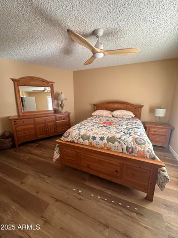 a bedroom with a bed and dresser