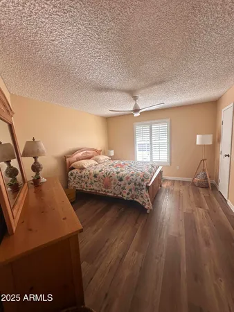 a bedroom with two beds and a large window