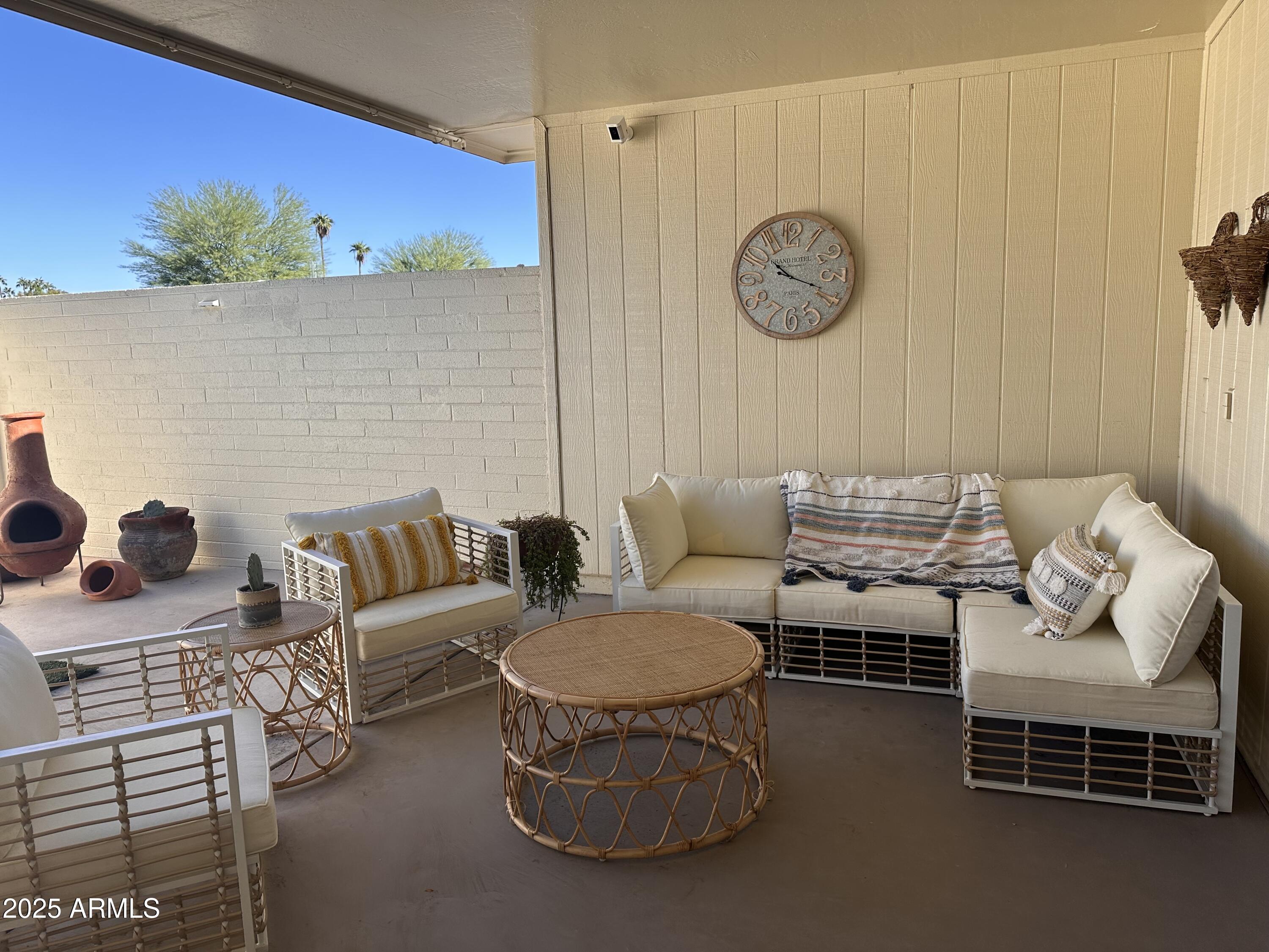 17247 North 106th Avenue Sun City, AZ 85373 - Photo 20 of 30 a living room with furniture and a wall clock