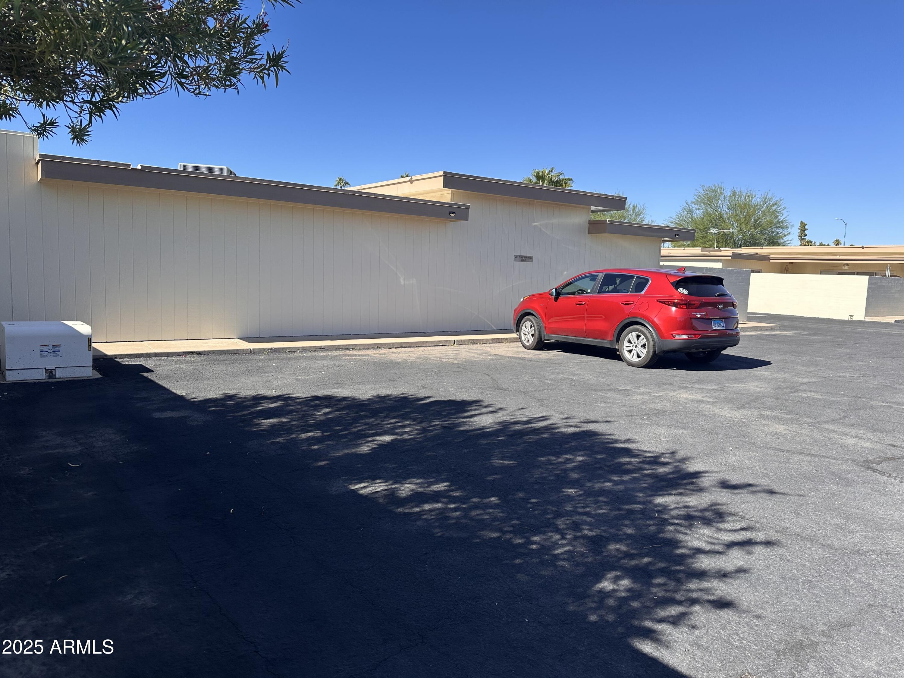 17247 North 106th Avenue Sun City, AZ 85373 - Photo 24 of 30 a car parked on the side of the road