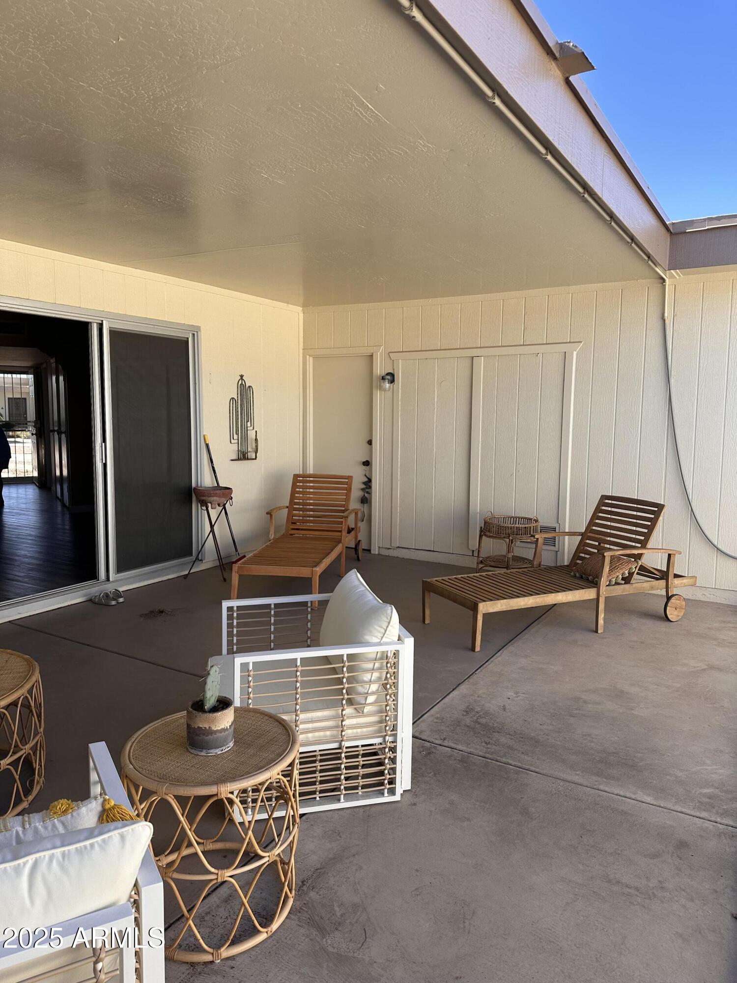 17247 North 106th Avenue Sun City, AZ 85373 - Photo 26 of 30 a room with table chairs and a dining table