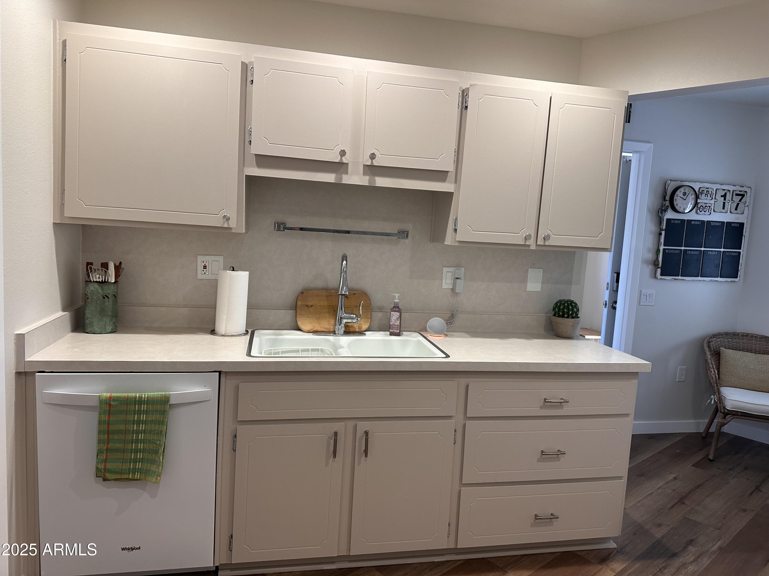 17247 North 106th Avenue Sun City, AZ 85373 - Photo 8 of 30 a kitchen with cabinets appliances a sink and a counter space