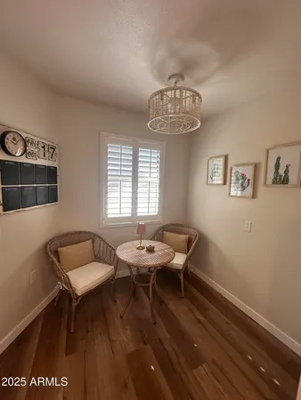 a dining room with furniture and window