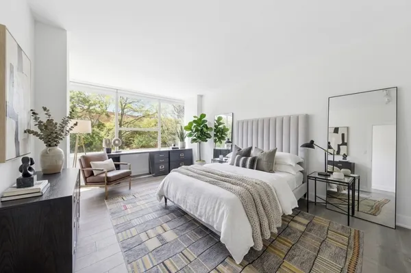 a bedroom with a bed and a couch