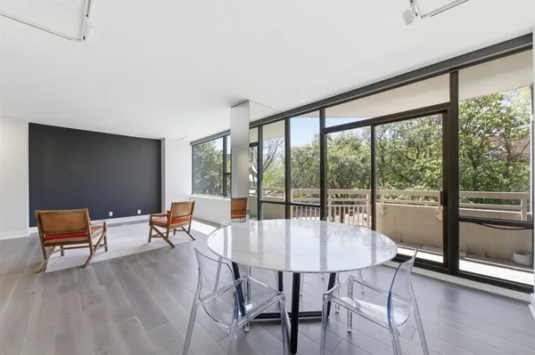a dining room with furniture window and outside view