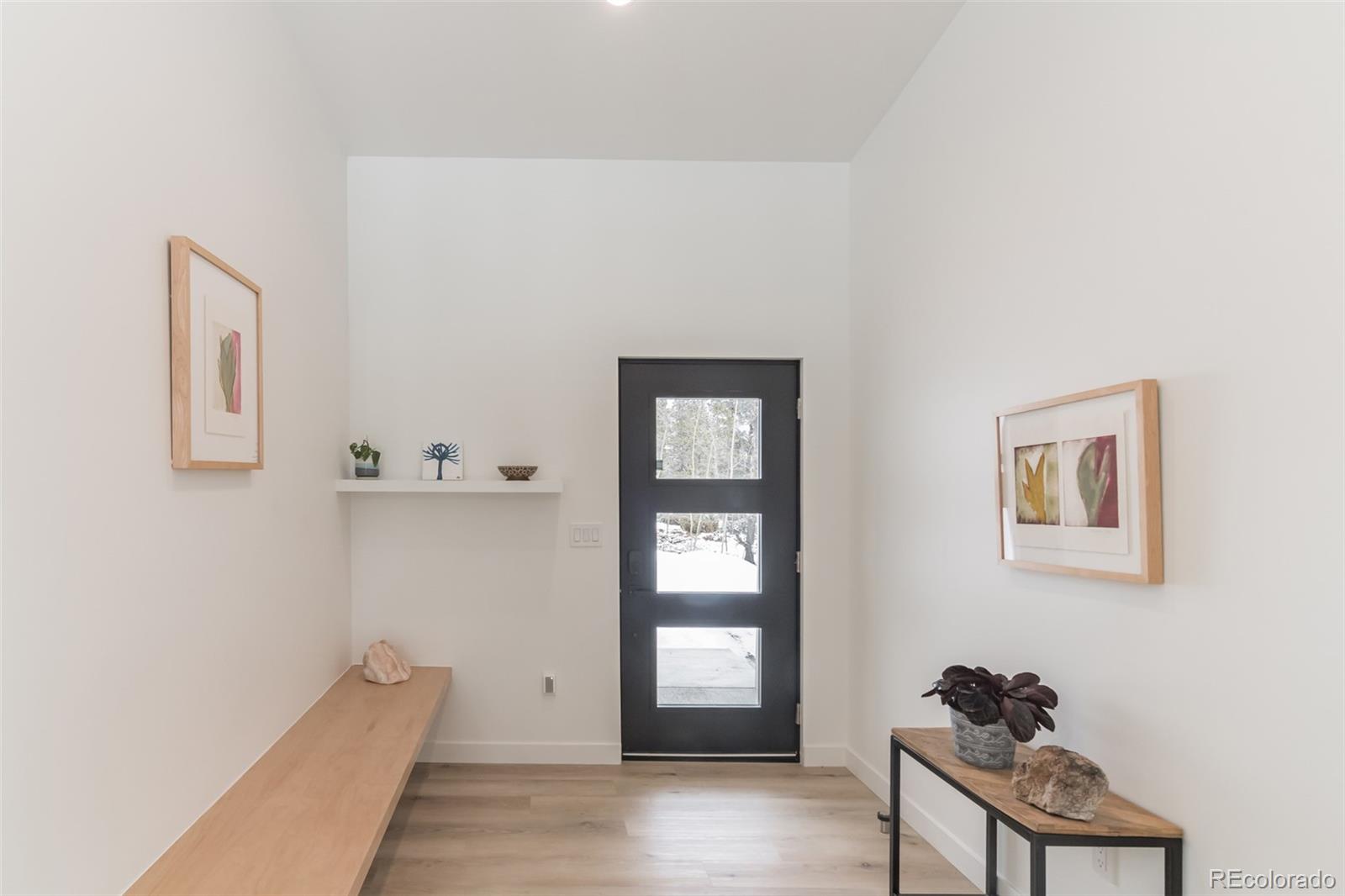118 Quartz Road Black Hawk, CO 80422 - Photo 20 of 35 a view of an entryway with wooden floor