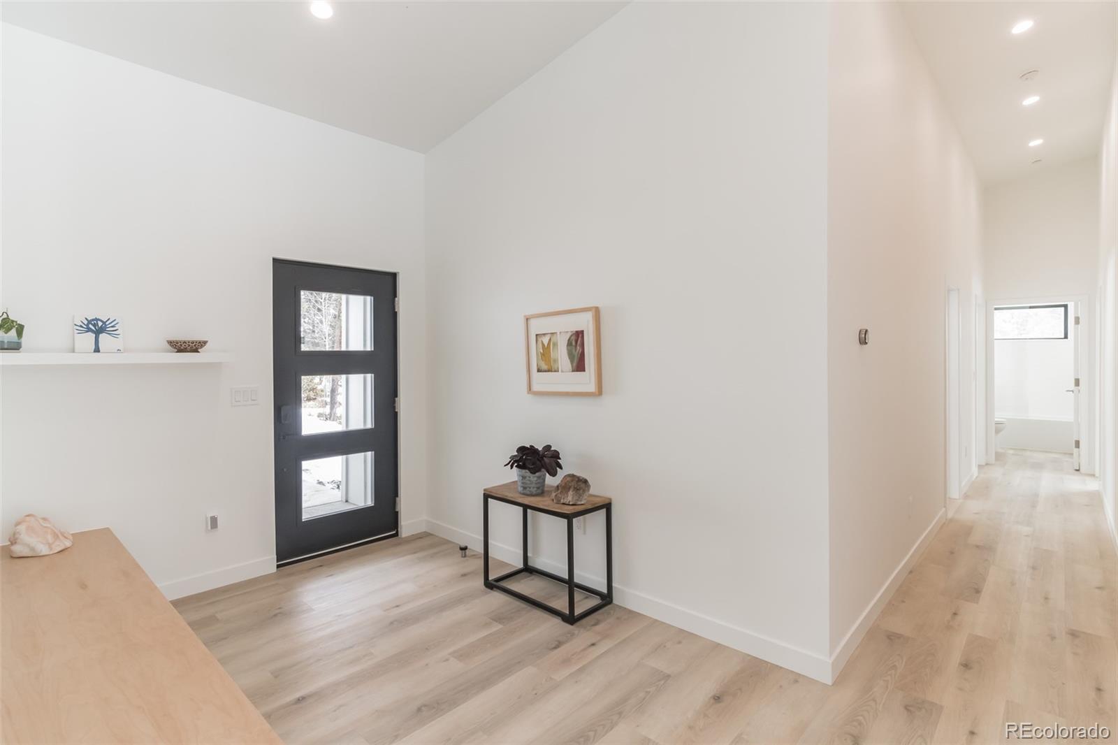 118 Quartz Road Black Hawk, CO 80422 - Photo 21 of 35 a bedroom with a bed and a window
