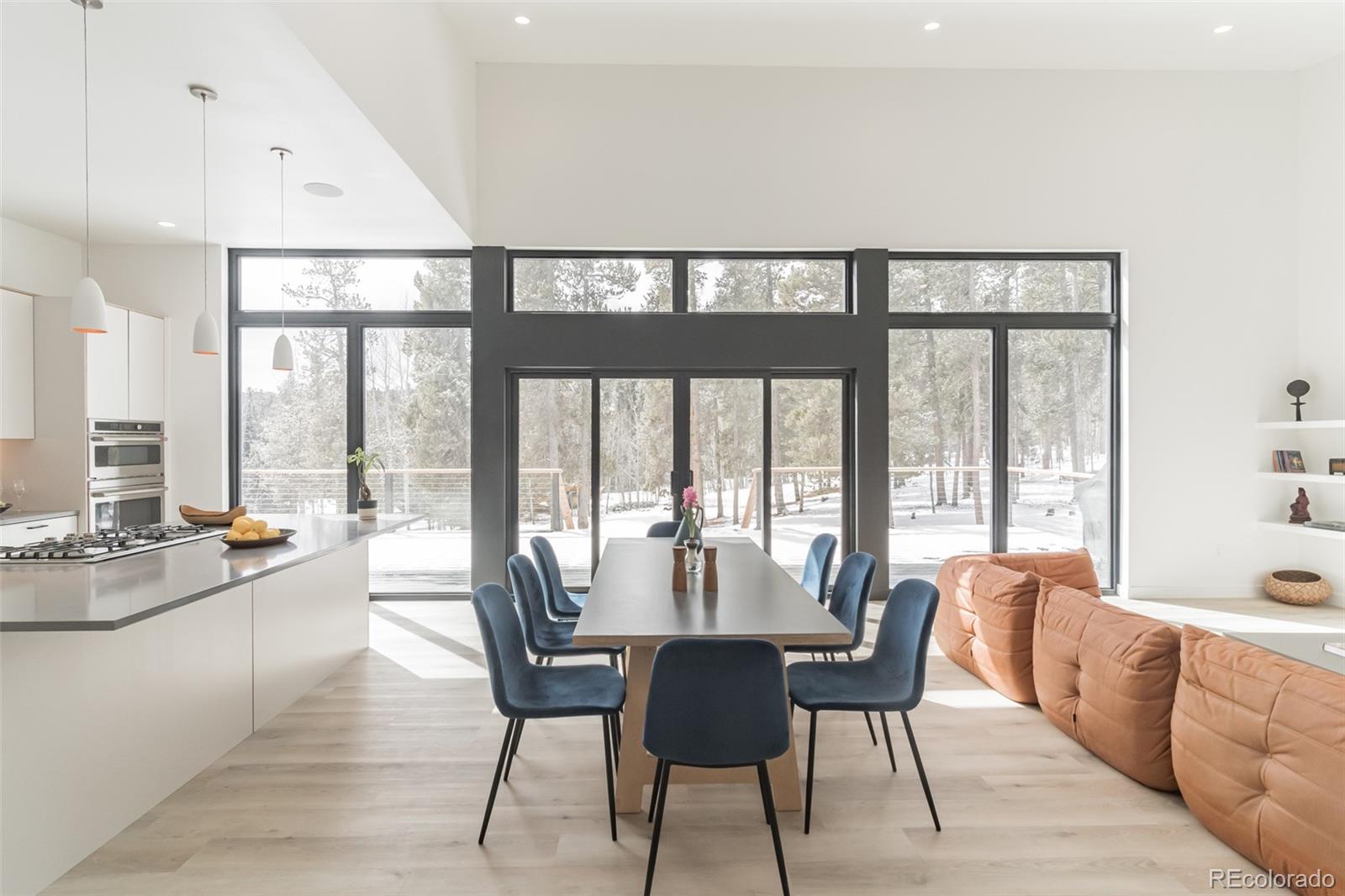118 Quartz Road Black Hawk, CO 80422 - Photo 4 of 35 a dining room with furniture a chandelier and wooden floor
