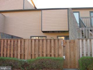 0 Edward Taylor Road, Unit 30 Ocean City, MD 21842 - Photo 1 of 6 a view of a backyard with wooden fence