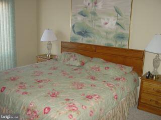 0 Edward Taylor Road, Unit 30 Ocean City, MD 21842 - Photo 4 of 6 a bed with white sheets and pillows on it