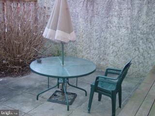 0 Edward Taylor Road, Unit 30 Ocean City, MD 21842 - Photo 6 of 6 a table and chairs in a room