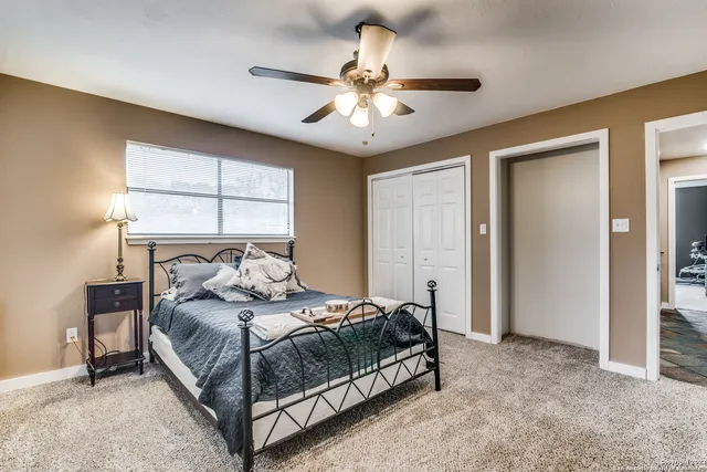 a bedroom with a bed and window