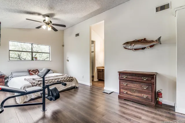 a view of a livingroom with furniture and a ceiling fan