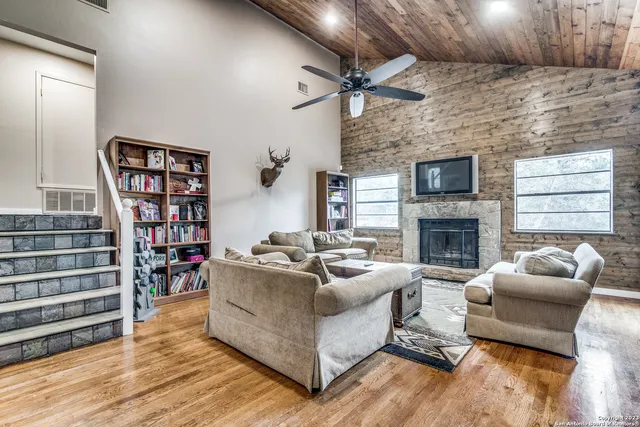 a living room with furniture and a fireplace