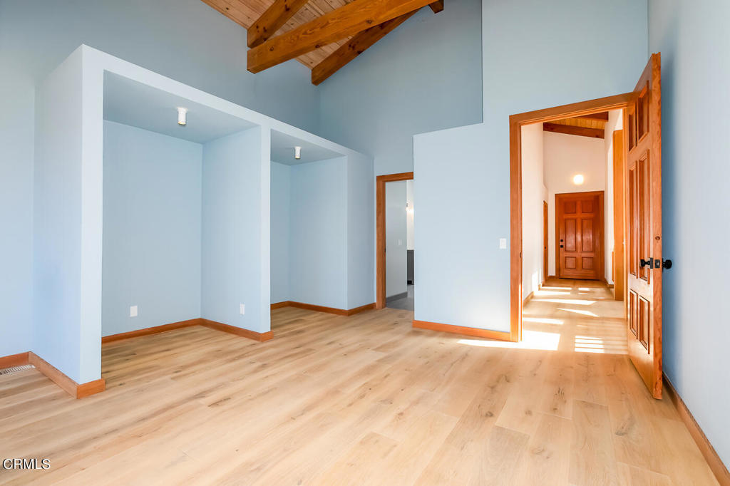 45460 Indian Shoals Road Mendocino, CA 95460 - Photo 18 of 50 a view of an empty room with wooden floor and a bathroom
