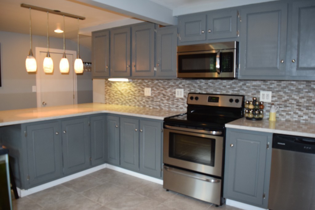 40 Joseph Road Framingham, MA 01701 - Photo 8 of 30 a kitchen with a stove and a microwave