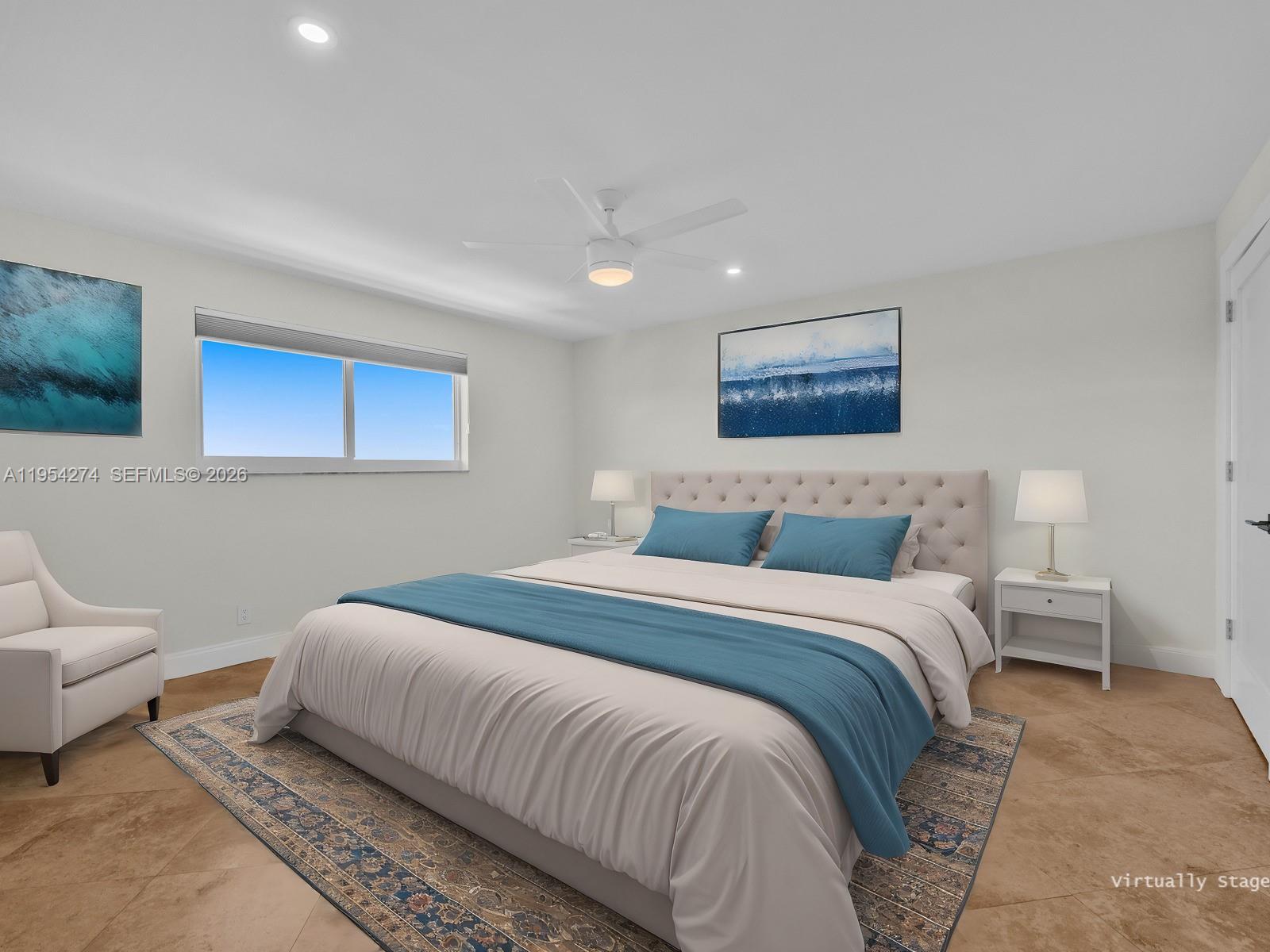 750 Northeast Spanish River Boulevard, Unit 5050 Boca Raton, FL 33431 - Photo 15 of 41 a bedroom with a bed and a couch