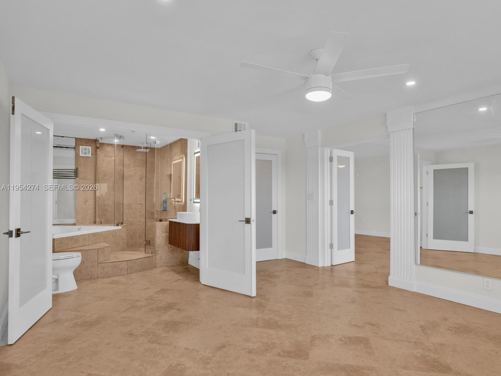 750 Northeast Spanish River Boulevard, Unit 5050 Boca Raton, FL 33431 - Photo 20 of 41 a view of a big room with a cabinet and mirrors