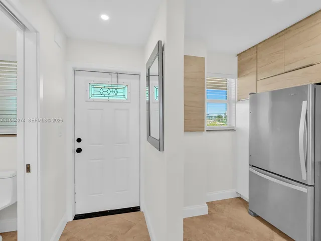 a view of walk in closet with white walls