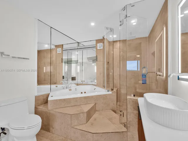 a bathroom with a tub and a sink