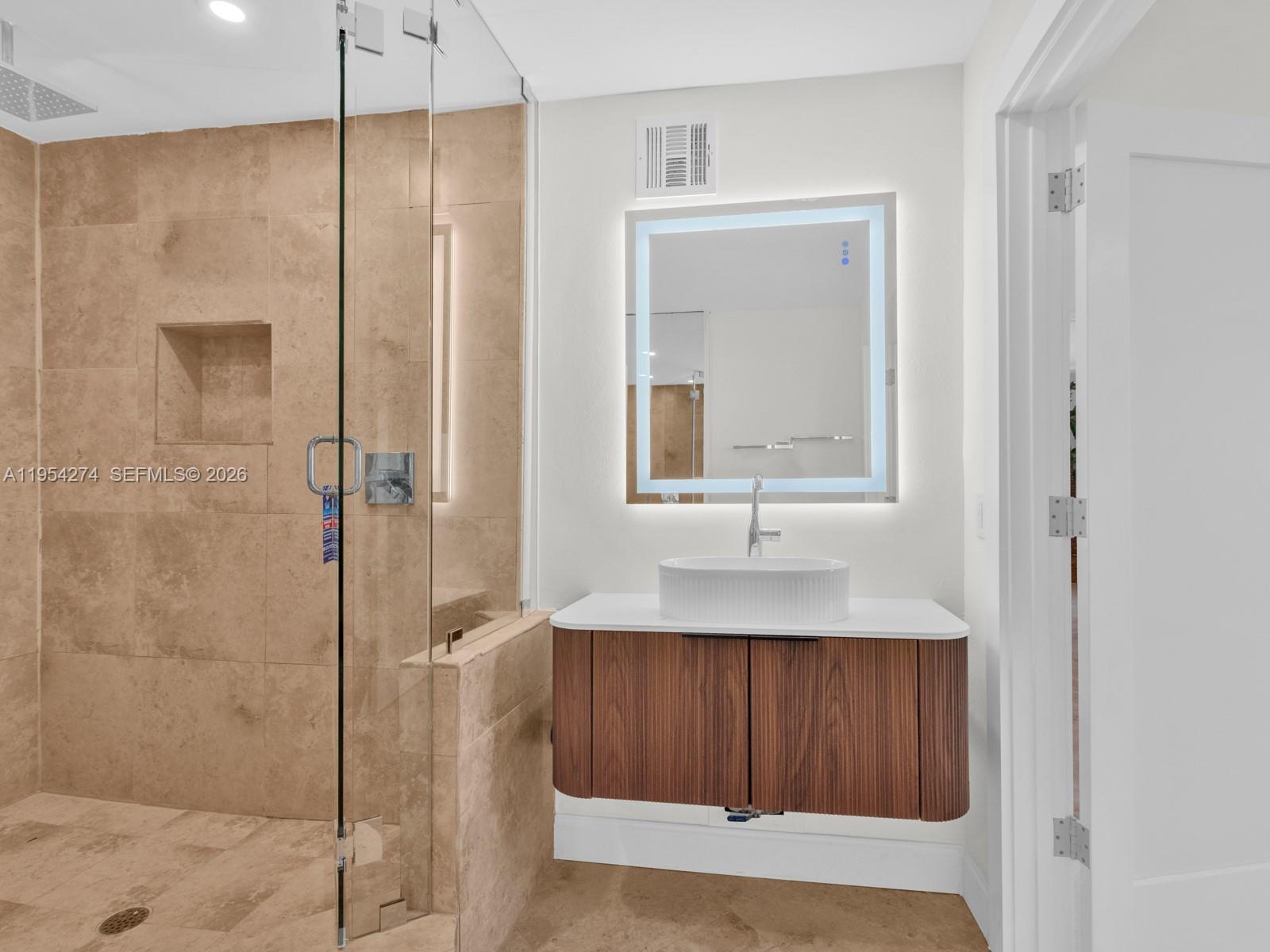 750 Northeast Spanish River Boulevard, Unit 5050 Boca Raton, FL 33431 - Photo 24 of 41 a bathroom with a shower and a sink