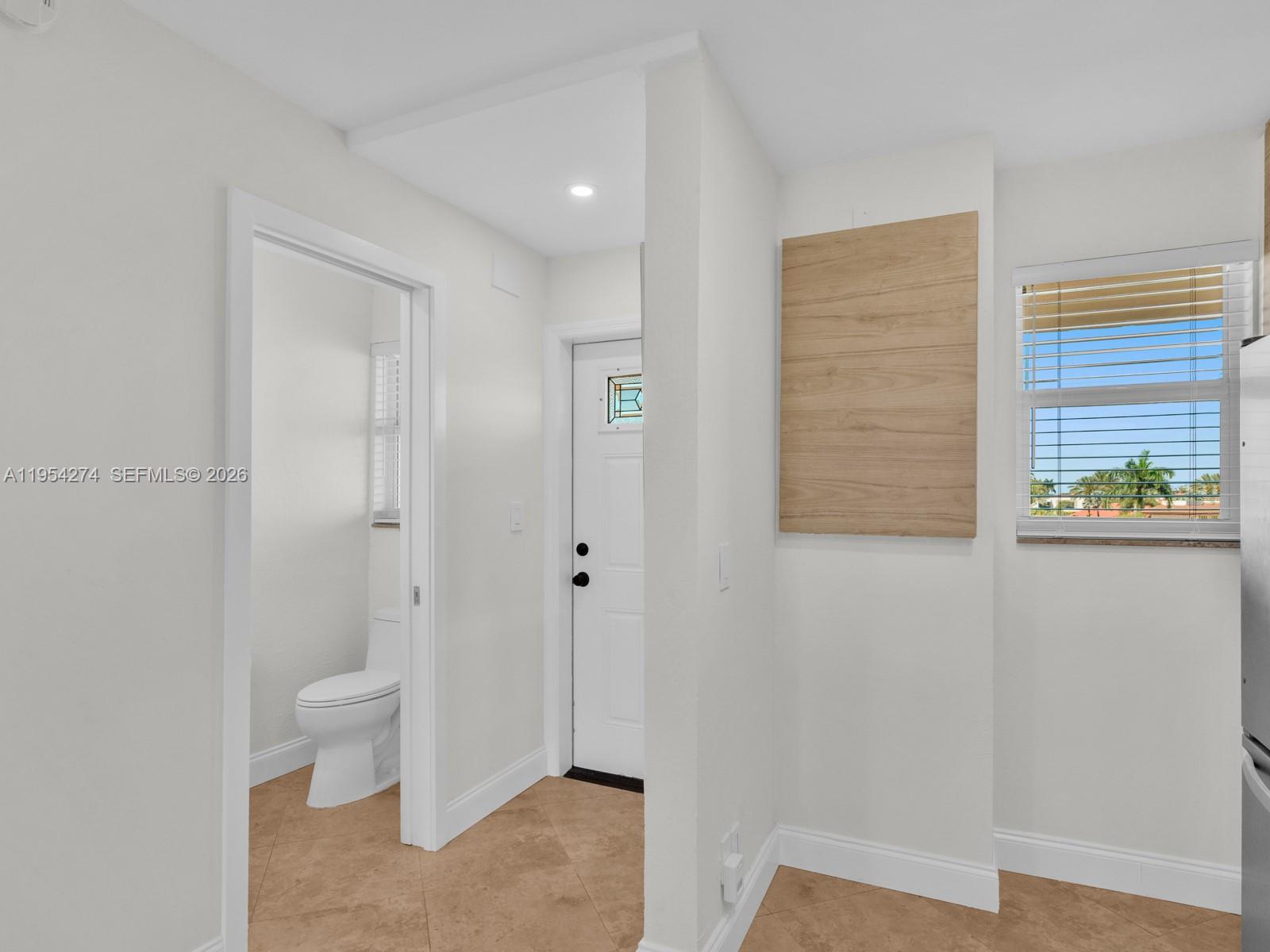 750 Northeast Spanish River Boulevard, Unit 5050 Boca Raton, FL 33431 - Photo 3 of 41 a bathroom with a toilet