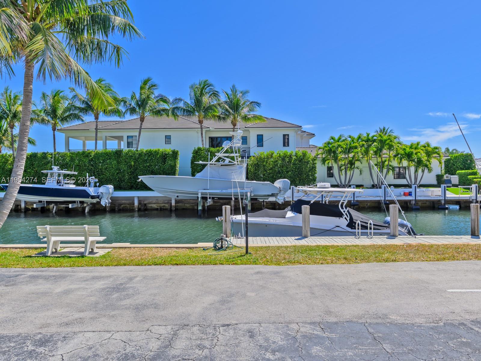 750 Northeast Spanish River Boulevard, Unit 5050 Boca Raton, FL 33431 - Photo 31 of 41 a view of swimming pool with outdoor seating and house in the background