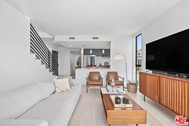 a kitchen with a sink stove and refrigerator