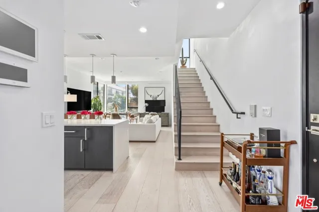 a bedroom with a large bed and a large window