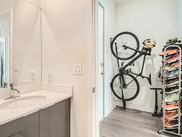 a bathroom with a sink a mirror and a window